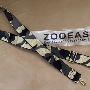 New in the box.  Zooeass rare Gold Grey and Black Camouflage Crossbody Strap